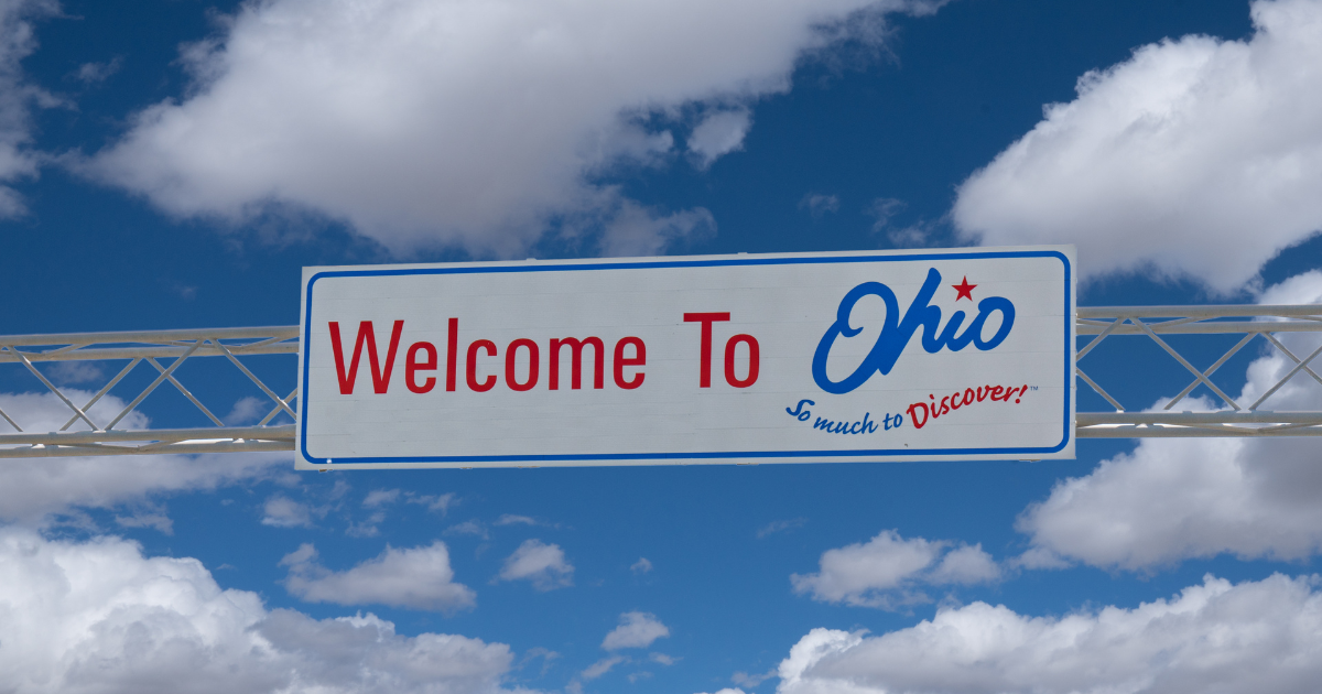 Overpass sign with blue sky background welcoming people to Ohio Overpass sign with blue sky background welcoming people to Ohio